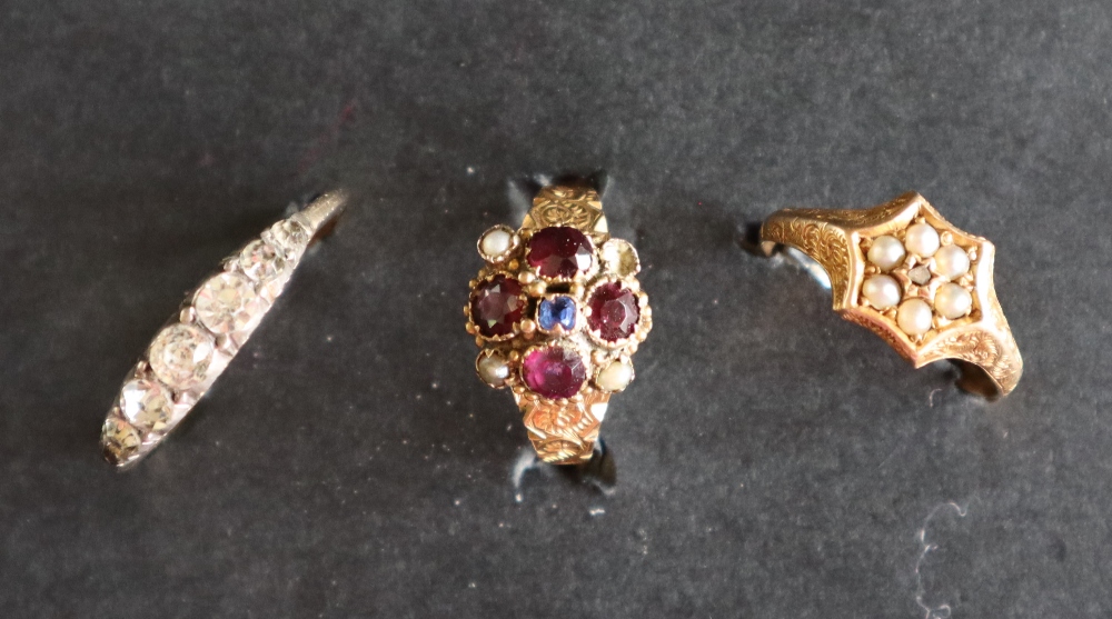 A gem set dress ring, size K 1/2, marked 12.