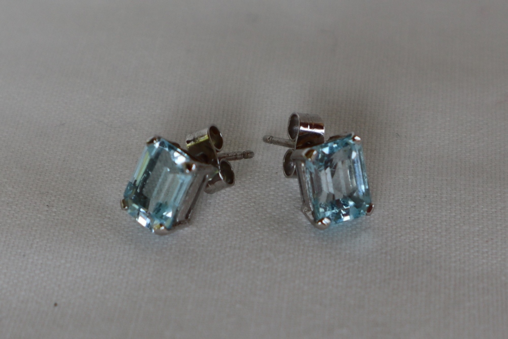 A pair of topaz single stud earrings each emerald cut approximately 2cts to a white metal setting - Image 2 of 4