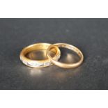 A 22ct gold and platinum two tone wedding band, size P together with another 22ct gold wedding band,