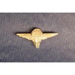 A 9ct Gregory and Quilter Parachute Company badge,