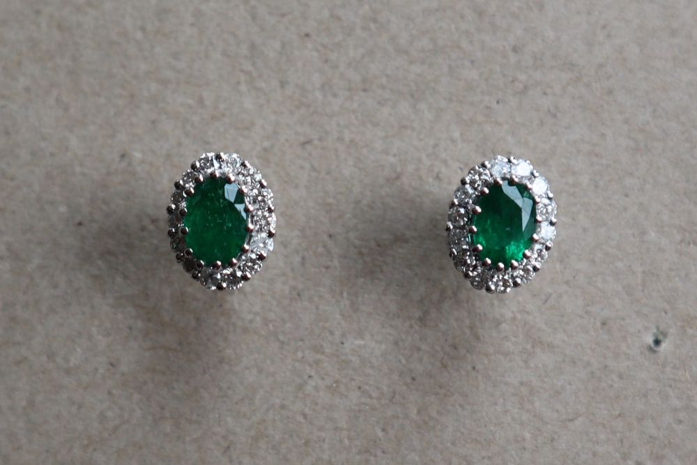 A pair of emerald and diamond cluster earrings,