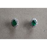 A pair of emerald and diamond cluster earrings,