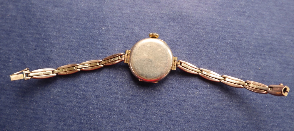 A lady's 9ct gold wristwatch with a circular white enamel dial with Arabic numerals on a 9ct gold - Image 9 of 9