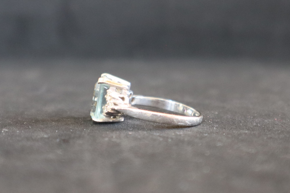 An aquamarine and diamond dress ring, set with an emerald cut aquamarine approximately 3. - Image 3 of 7