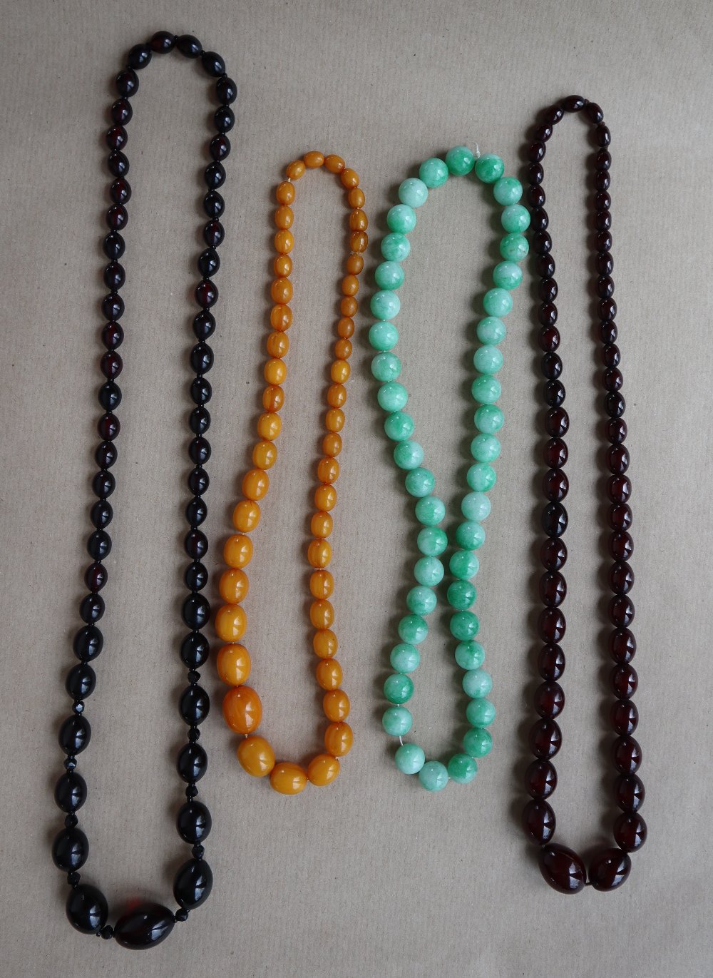 A Cherry amber / bakelite bead necklaces, with oval beads ranging in size from, 23mm to 8mm, - Image 4 of 14