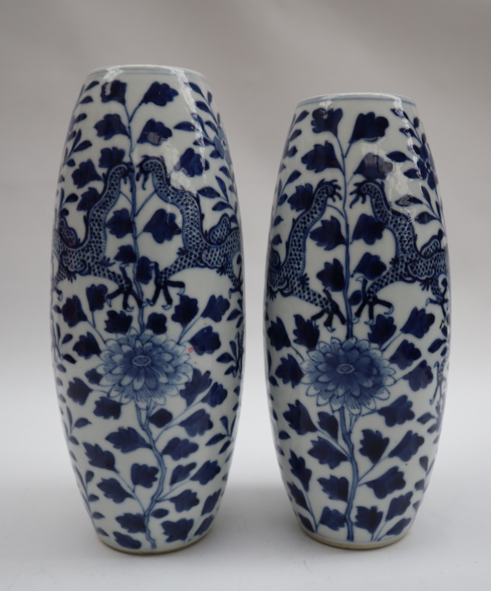 A pair of Chinese porcelain vases of tapering shape decorated with four toed dragons, - Image 4 of 7