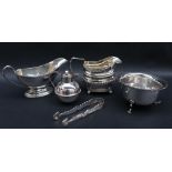 A George V silver sauce boat with a line decorated rim and foot, London, 1916,