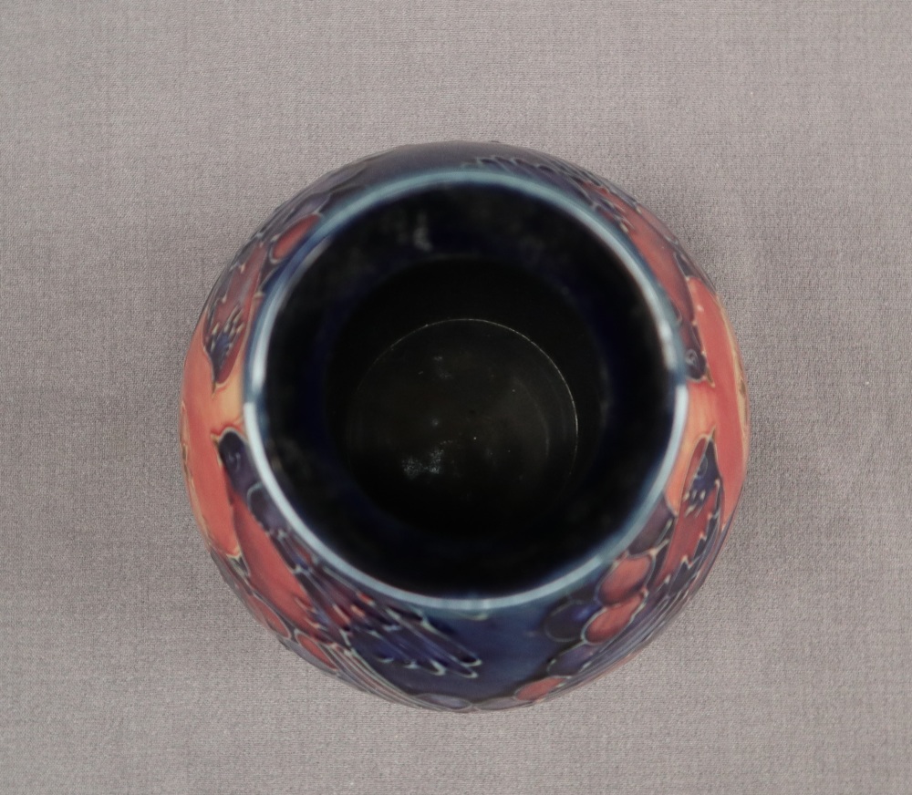 A Moorcroft pottery vase decorated with birds and fruit to a royal blue ground, - Image 8 of 9