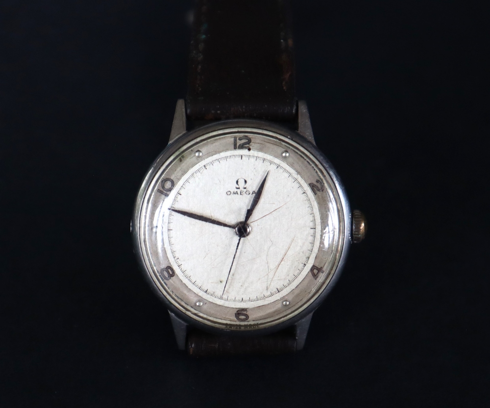 A mid-20th century Omega wristwatch, the silvered dial with Arabic numerals and dot markers,