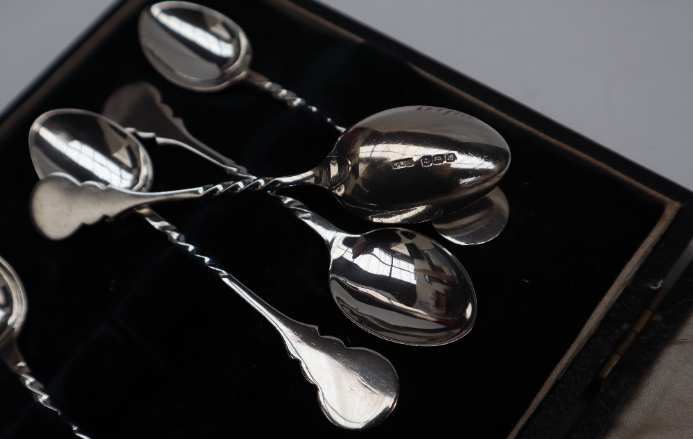 A set of six George V cased silver coffee spoons, Birmingham, 1925 together with a rattle, - Image 3 of 4