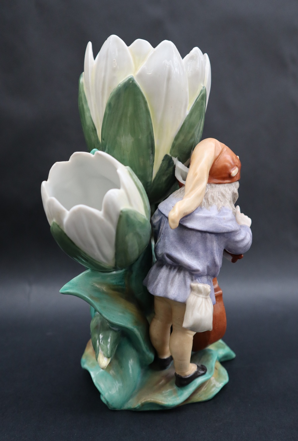 A continental porcelain triple lily vase moulded with a bearded sprite playing a cello with the - Image 5 of 9