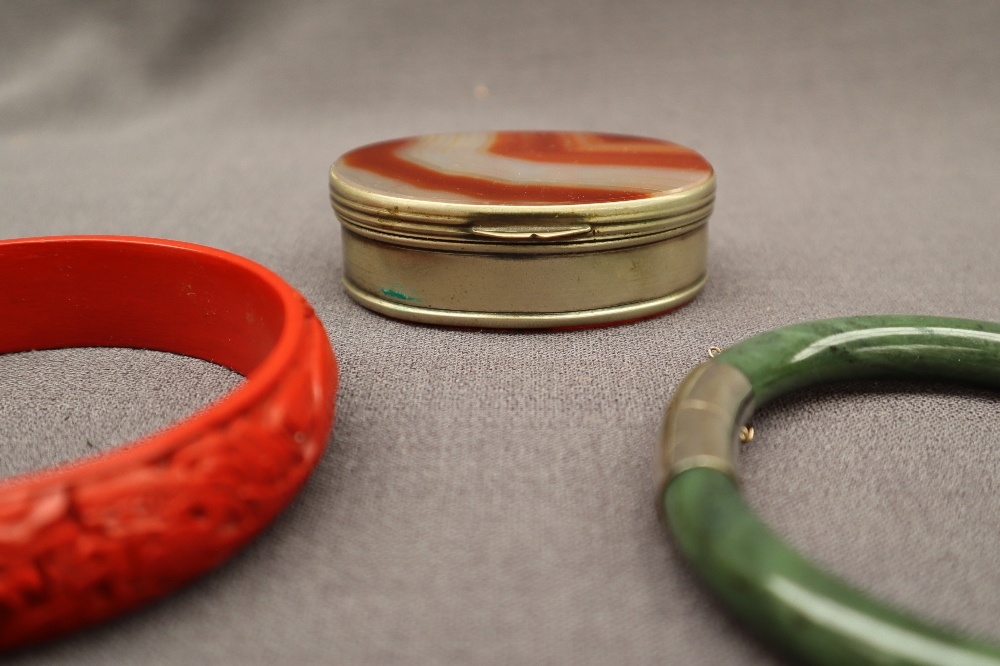 A hardstone box, together with a lattice ring, a jade bangle, another bangle, other wristwatches,