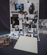 The Beatles white album No 0346775 together with revolver and Sgt Peppers album