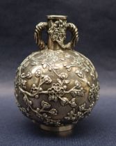 A Chinese white metal twin handled vase decorated with prunus blossom, marked to the base,
