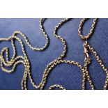 A 9ct yellow gold long chain with oval faceted links,