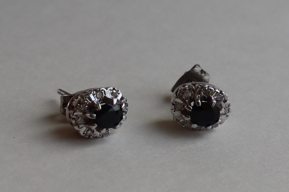 A pair of sapphire and diamond cluster earrings, each set with an oval cut sapphire approximately 0. - Image 3 of 5