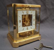 A Jaeger Le Coultre Atmos clock the square dial with Arabic numerals and batons, 23.