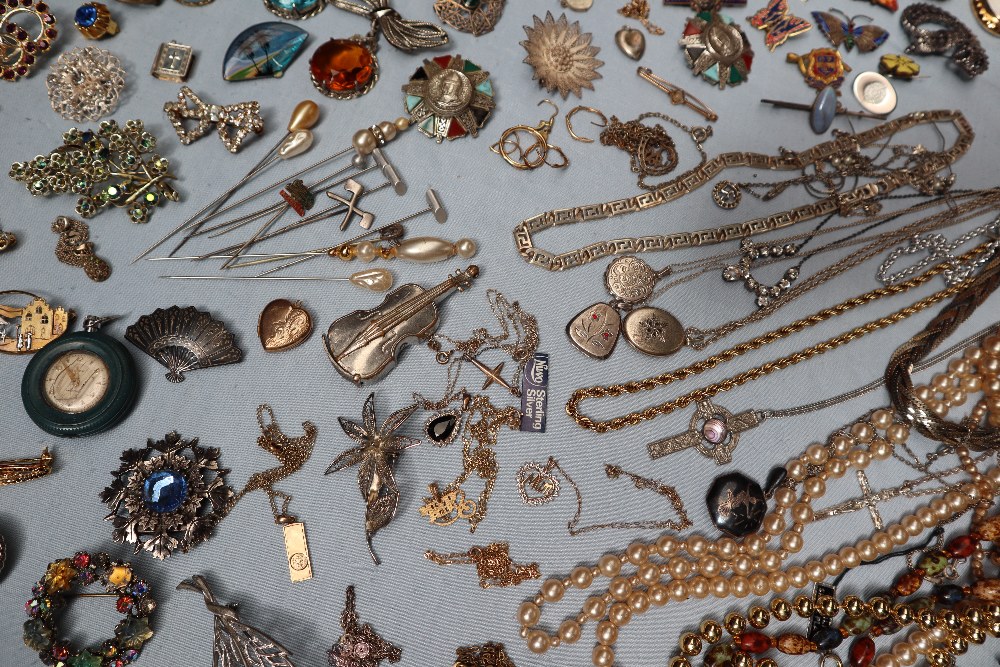 A large collection of costume jewellery including earrings, faux pearl necklaces, rings, medallions, - Image 3 of 7