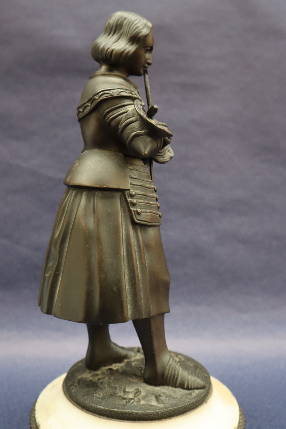 A bronze figure of Joan of Arc, with head bowed clutching a sword, on a circular marble base, 27. - Image 5 of 8