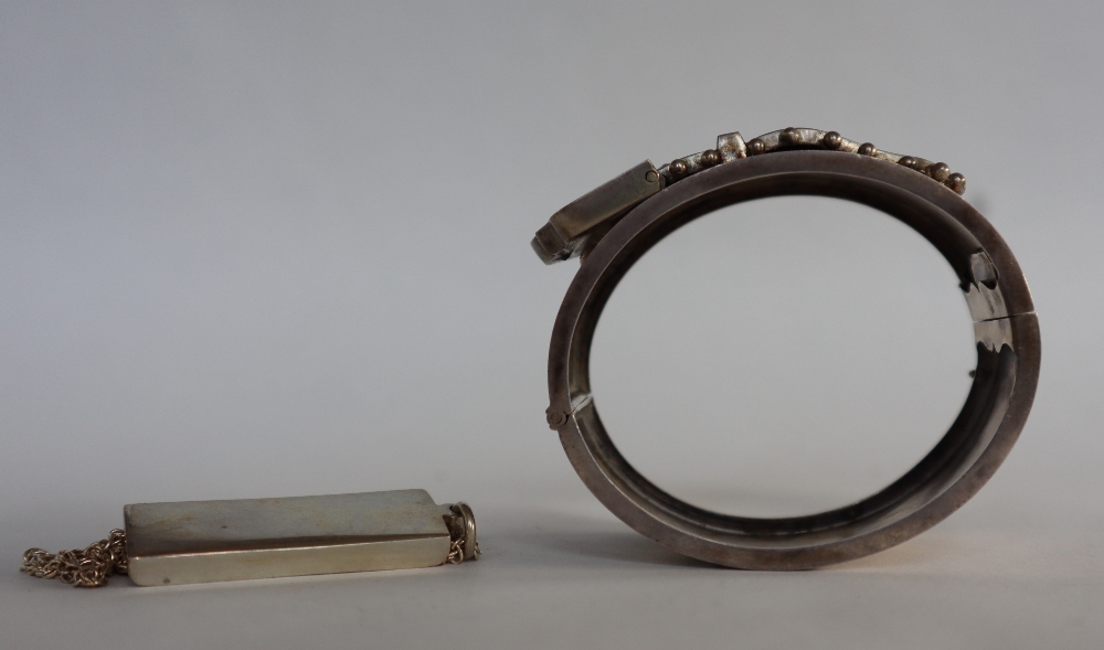 A silver ingot, Sheffield, 1978 on white metal chain, together with a silver buckle hinged bangle, - Image 5 of 5