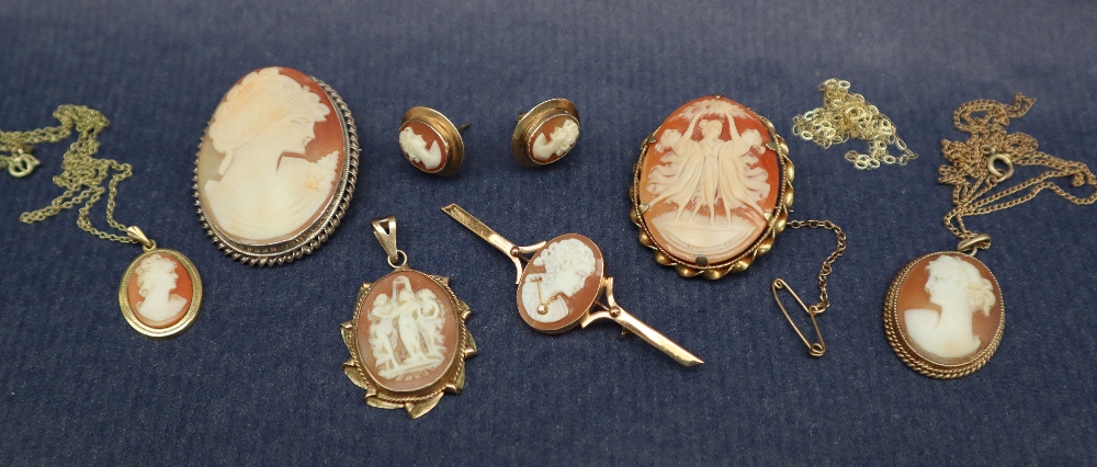 A shell cameo brooch of the three graces in a 9ct gold mount together with another shell cameo