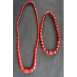 A Cherry Amber / Bakelite bead necklace, with barrel shaped beads ranging in size from 27mm to 15mm,