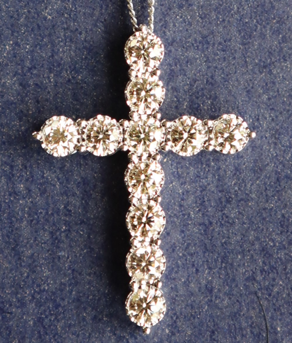 A diamond crucifix set with eleven round brilliant cut diamonds totalling approximately 2.41cts. - Image 2 of 5