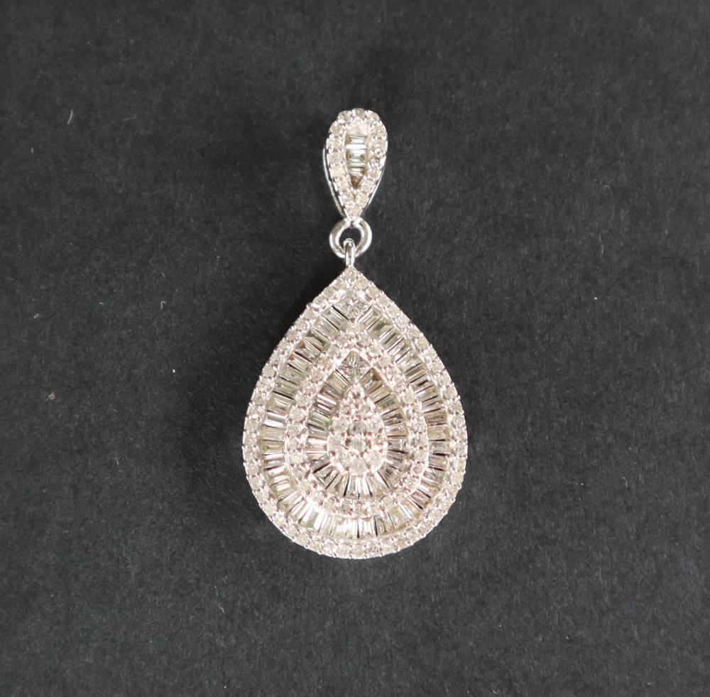 An 18ct white gold pendant set with approximately one hundred and seventy natural baguette,