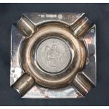 An Elizabeth II silver ashtray of square form with a Five Shillings coin inset, Sheffield, 1953,