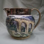 A 19th Century pottery jug decorated with a viaduct, trees and cattle with silver lustre highlights,