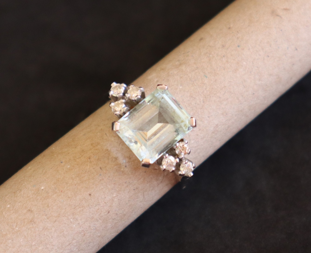 An aquamarine and diamond dress ring, set with an emerald cut aquamarine approximately 3. - Image 6 of 7