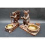 A Black Forest carved bear cigarette holder, brass ashtray and matchbox holder,