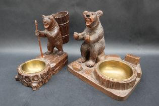 A Black Forest carved bear cigarette holder, brass ashtray and matchbox holder,