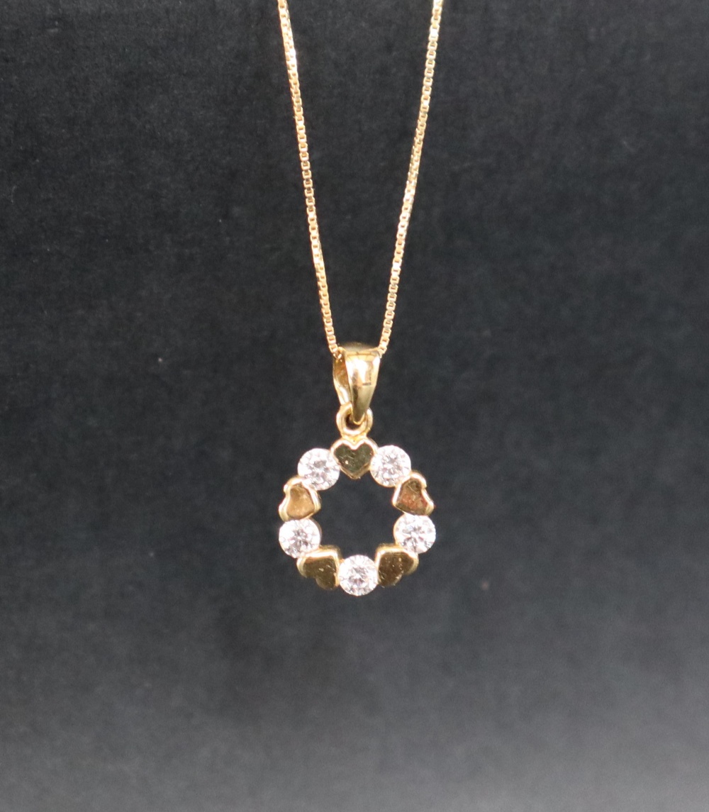 An 18ct yellow gold pendant of circular form, paste set, on an 18ct yellow gold chain, - Image 2 of 5