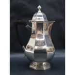 An Edward VII silver baluster hot water pot, London, 1908,