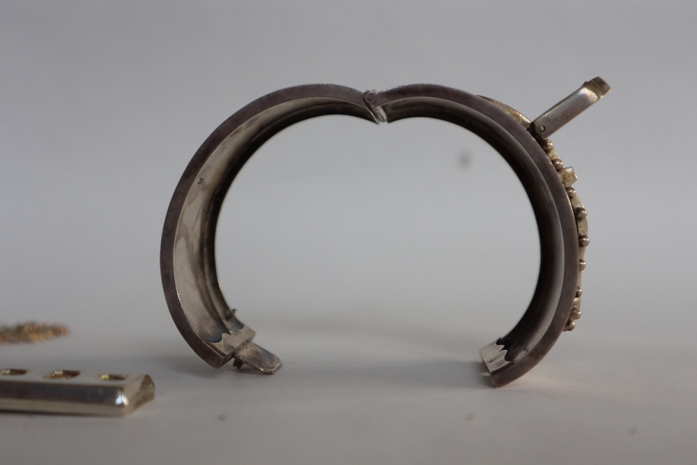 A silver ingot, Sheffield, 1978 on white metal chain, together with a silver buckle hinged bangle, - Image 4 of 5