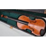 A violin with a two piece back, bears a trade label The Garrodus violin, dated 1897, overall 58.