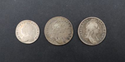 Two William III silver shillings dated 1696 together with a 1757 silver sixpence