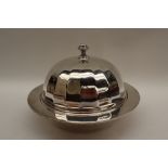 A George V silver muffin dish, liner and cover with a domed panelled cover and turned finial,