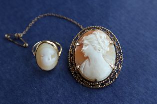 A shell cameo brooch of a lady in profile in a 9ct gold mount together with an 18ct gold shell