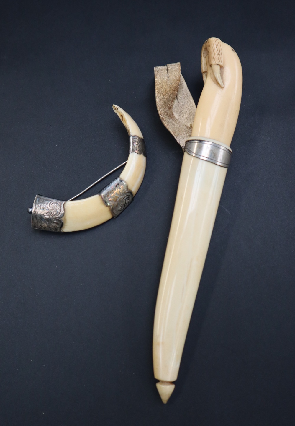 A walrus ivory dagger, the handle in the form of a walrus,