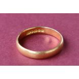 A 22ct gold wedding band, size L 1/2,