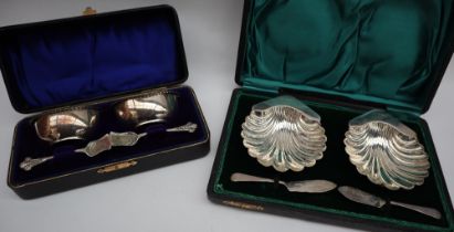 A pair of Edward VII silver shell shaped butter dishes, Birmingham, 1906,
