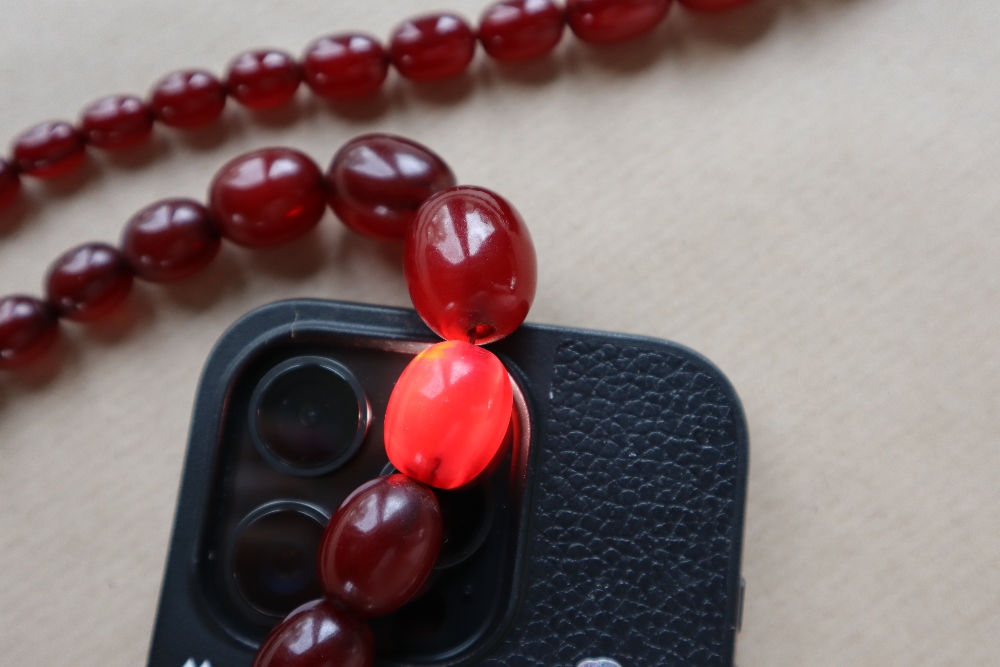 Two Cherry Amber / bakelite bead necklaces, ranging in size from 30mm to 10mm, 79cm long, - Image 5 of 12