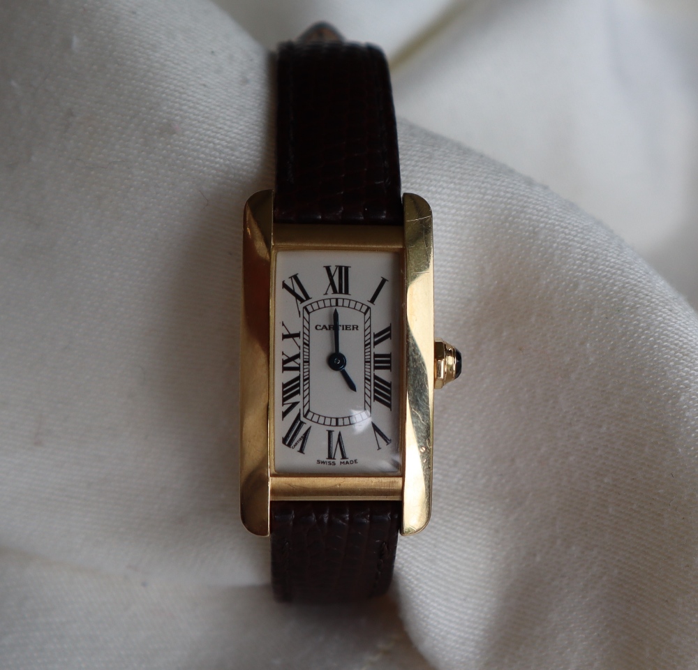 A lady's 18ct yellow gold Cartier tank Americaine wristwatch with a curved rectangular bezel and