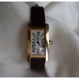 A lady's 18ct yellow gold Cartier tank Americaine wristwatch with a curved rectangular bezel and