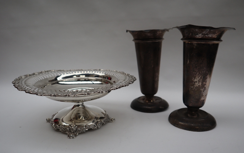 A Blair & Crawford sterling silver pedestal dish with a pierced scrolling edge and shaped foot,