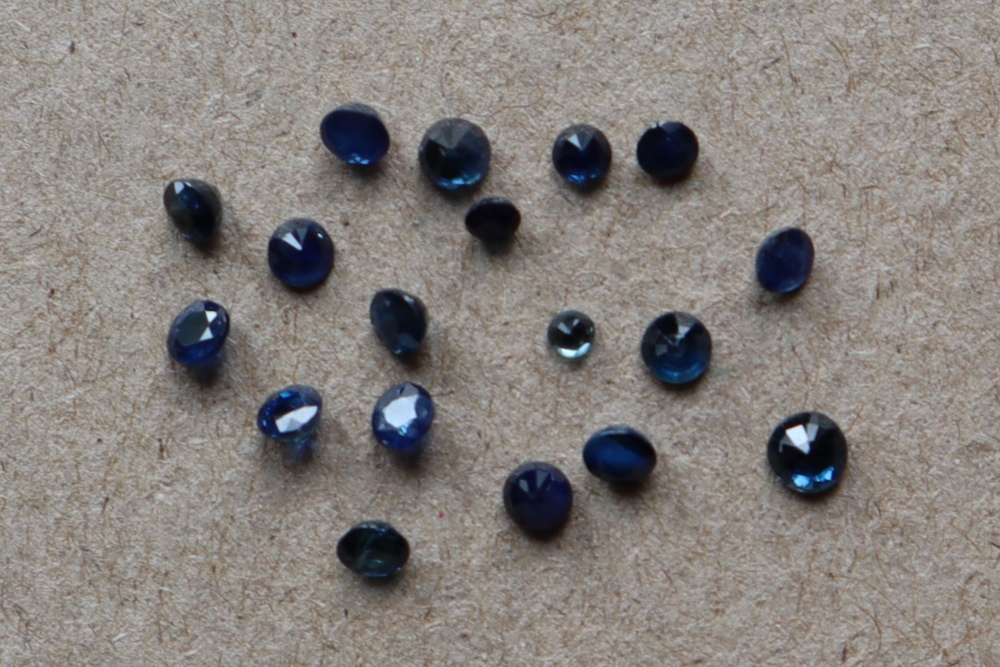 A collection of unmounted mixed round-cut sapphires totalling approximately 2.