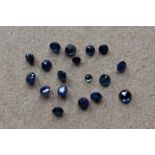 A collection of unmounted mixed round-cut sapphires totalling approximately 2.