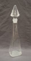 A Steven Newell glass decanter, with a pyramid shaped stopper and a tapering body on a square base,